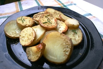 Baked potato on the plate with spices