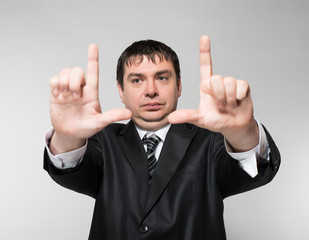 Businessman's hands making frame.