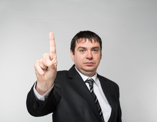 businessman showing one finger