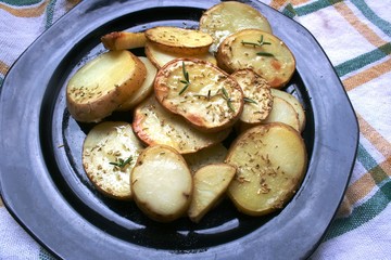 Baked potato on the plate with spices