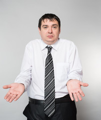 portrait of a young businessman hand on gray background