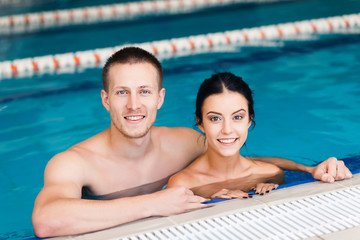 Young couple in the swimming pool