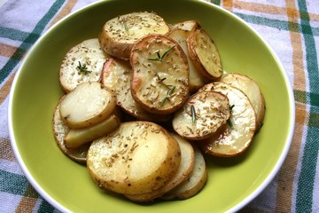 Baked potato on the plate with spices