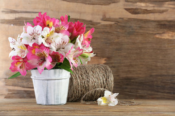 Bouquet of alstroemeria on wooden background
