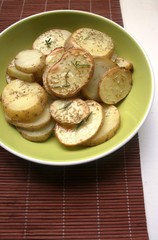 Baked potato on the plate with spices