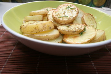 Baked potato on the plate with spices