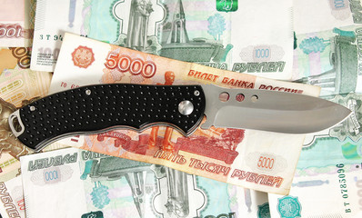 The knife on the money