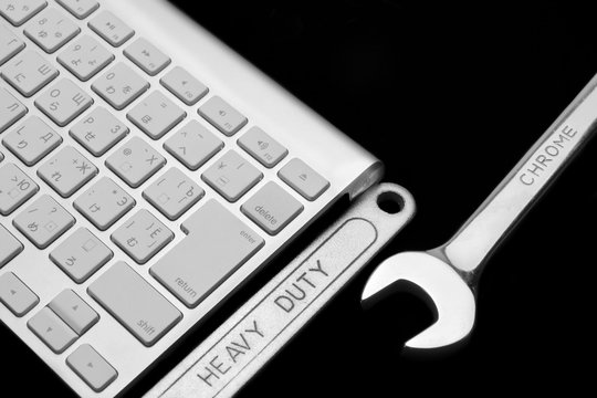 Wrench With Heavy Duty Sign And Wireless Keyboard Isolated