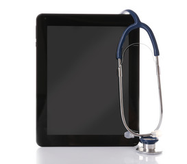 Stethoscope and tablet isolated on white