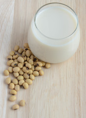 Fresh Soy milk (Soya milk) in a glass and soybean seeds