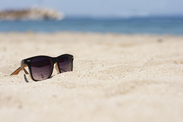 Fototapeta na wymiar Sun glasses on a beach