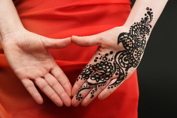 Image of henna on female hand, closeup