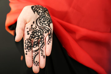 Image of henna on female hand, closeup