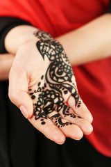 Image of henna on female hand, closeup