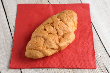 Croissant on old wooden table