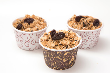 Granola in cupcake cases  on white background