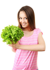 Healthy young woman with bunch of lettuce isolated on white