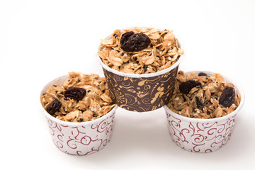 Granola in cupcake cases  on white background