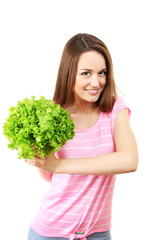 Healthy young woman with bunch of lettuce isolated on white