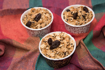 Granola in cupcake cases  on white background