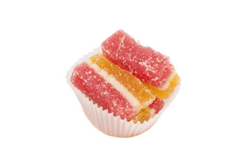 jelly candies in white cup cake case isolated on white