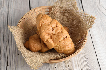 Croissant on old wooden table