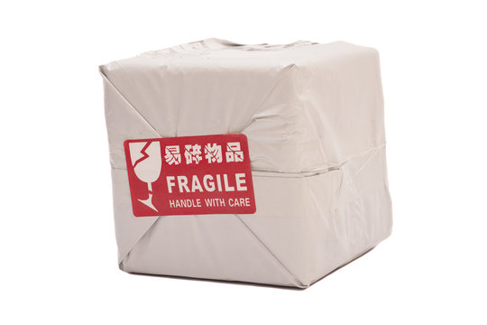 Postal package box or shipping box with a "Fragile - Handle with