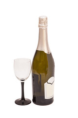 Bottle of champagne and goblet on white background