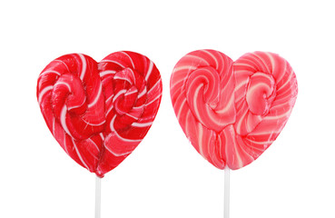 Two heart shaped lollipops isolated on white