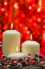 White candles in autumn winter decoration