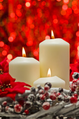 White candles in autumn winter decoration
