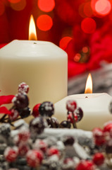 White candles in autumn winter decoration