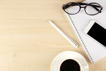 Top view of working place elements on wooden table