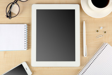 Top view of working place elements on wooden table