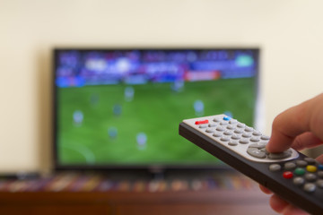 Television remote control in human hands