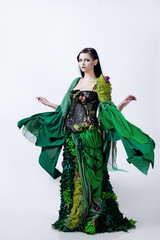 Fashion photo  young magnificent woman in green dress,  the