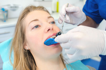 Woman having her teeth moulded