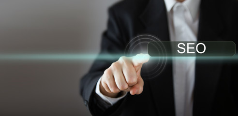 Businessman's hand pressing the icon on virtual screen