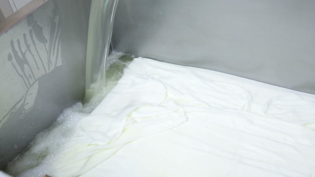 The process of producing tasty traditional white Bulgarian feta cheese at its final stage before packeting.
