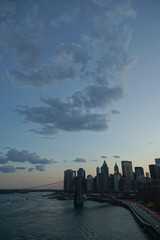 Lower Manhattan skyline under a towering sky