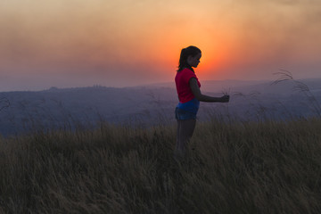 Fototapeta na wymiar Girl Fun Sunset Landscape