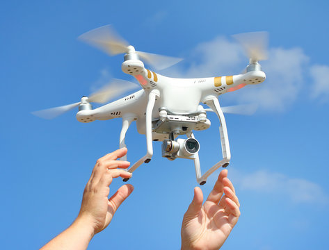 Drone quadrocopter with high resolution digital camera. New tool for aerial photo and video.