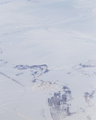 Fototapeta na wymiar snowy land. view from the airplane