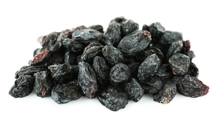 Pile of black dried sultana isolated on white