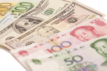 Obraz na płótnie Canvas American dollars, European euro and Chinese yuan bills
