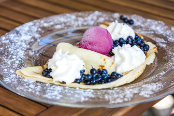 pancake with ice cream and blueberries