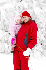 Fototapeta premium portrait of mother with little daughter in winter