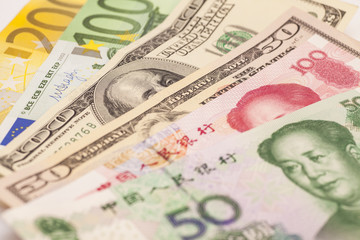 Obraz na płótnie Canvas Chinese yuan, European euro notes and American dollars