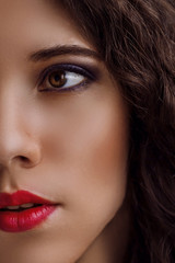Naklejka premium Close portrait of a beautiful young girl with makeup in pink and purple colors