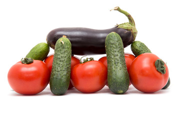 cucumbers, tomatoes and eggplant on a white background